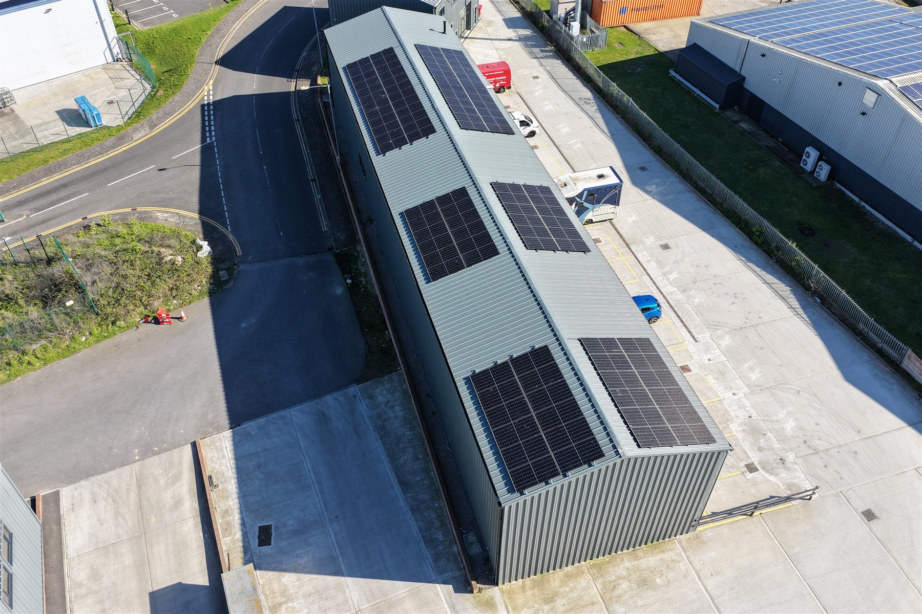 Overhead drone view of a large commercial solar panel layout