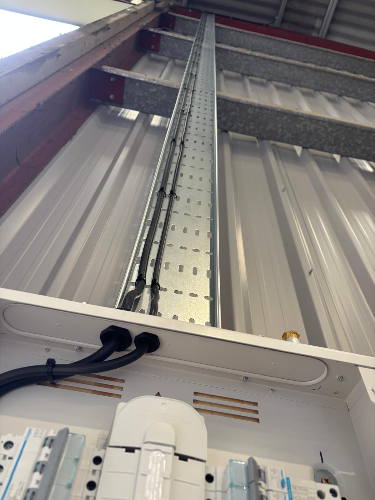 Neat high-level cable containment within a commercial building